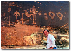 Ian Thompson viewing petroglyphs.