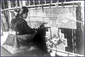 Weaving rug on loom. Courtesy Denver Public Library, Western History Collection, Jesse L. Nusbaum, N-338.