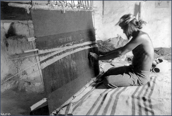 Man weaving on loom. Courtesy Denver Public Library, Western History Collection, X-30906.