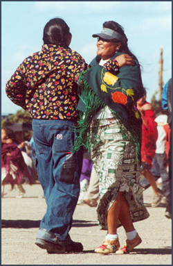 Man and woman at Bear Dance. Photo by Wendy Mimiaga.